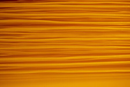 Geometric pattern with line rubber straight in the form of luminous. Abstract yellow background.