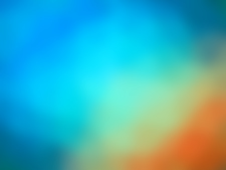 Abstract rainbow gradient orange green blue colored blurred background.の写真素材