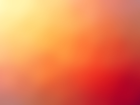 Abstract gradient red orange yellow colored blurred background.の写真素材