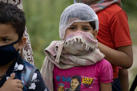 Disaster Pandemic covid -19 corona virus in India . People returning home from different states, countries. Thermal scanning by doctors and administration.のeditorial素材