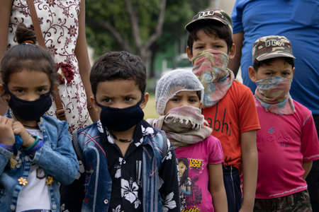 Disaster Pandemic covid -19 corona virus in India . People returning home from different states, countries. Thermal scanning by doctors and administration.のeditorial素材