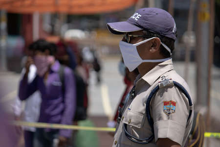 Dehradun, Uttarakhand/India- August 01 2020:  Police at work, people wearing mask because of...