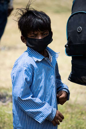 Dehradun, Uttarakhand/India- August 15 2020: A child wearing face mask, facing camera.