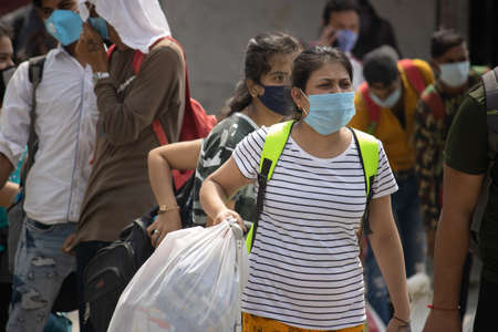 Dehradun, Uttarakhand/India-September 12 2020:A women at railway station, wearing face mask, Corona...