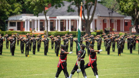 Dehradun, Uttarakhand India August 15, 2021. Indian flag at hands of young army officers at the...
