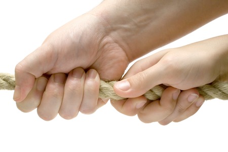 Man and woman pulling in one direction. Isolated on a white background.