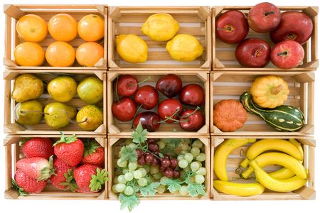 Wooden baskets with various toy fruits. Isolated on a white background.の写真素材