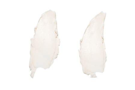 White cream swatches isolated on white background. Face cream lotion samples texture. Beauty lotion stroke on white.の写真素材