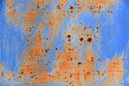 texture and pattern of blue metal door in rust