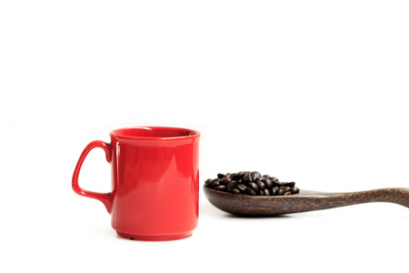 Red cup and roasted coffee beans on white background.の写真素材