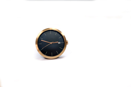 Golden watch show date in end year on white background.の写真素材