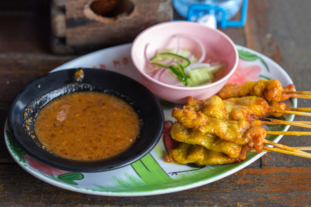 Pork satay and sauce on the table.の写真素材