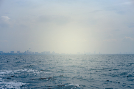 The sun shines in the sea in the morningの写真素材