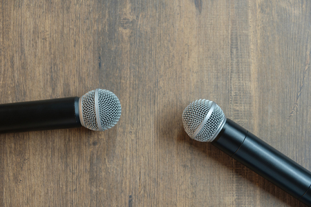 Top view two microphones on table. Concept of people talking but not listen each.の写真素材