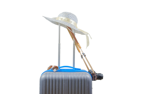 Luggage, hat, sunglasses and camera on white background with clipping path. Baggage of women when journey to travel.の写真素材