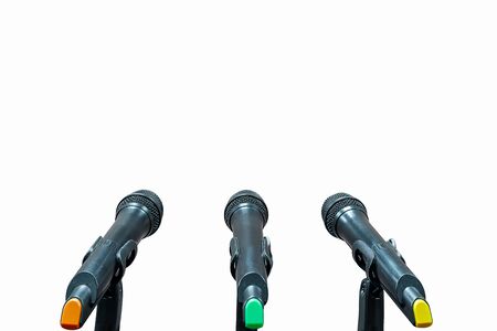 Closeup three microphones on whiteの写真素材