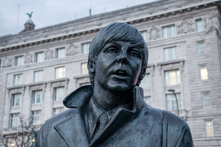 Liverpool, UK. March 22, 2022. A bronze statue of the Liverpool Beatles stands on the Liverpool Waterfront.のeditorial素材