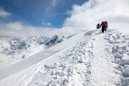 Landscape in the Polish Tatra Mountains. View of the snow-capped peaks in April.