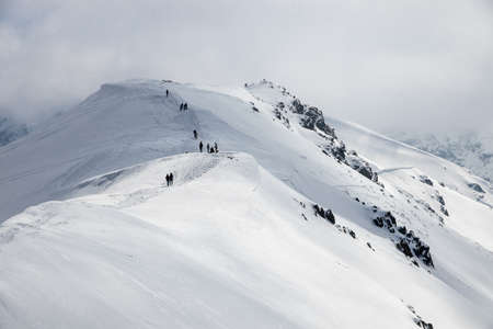 Landscape in the Polish Tatra Mountains. View of the snow-capped peaks in April.の写真素材