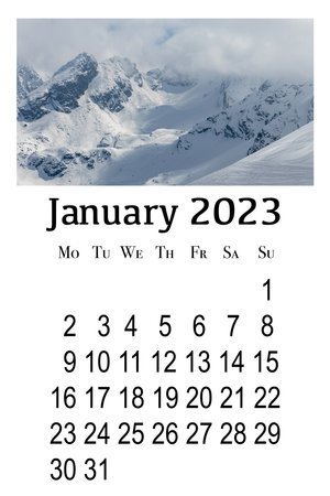 Calendar card for January 2023. Printable vertical wall calendar, week starts on Monday. Beautiful winter landscape in the Polish Tatra Mountains.の写真素材