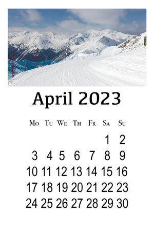 Calendar card for April 2023. Printable vertical wall calendar, week starts on Monday. Beautiful winter landscape in the Polish Tatra Mountains.の写真素材