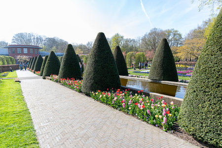 April 14, 2022 Lisse, The Netherlands. Beautiful public garden with spring flowers blooming. Popular tourist site.のeditorial素材