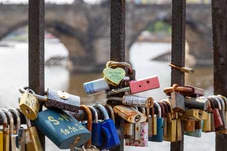 April 25, 2022 Prague Czech Republic. Colored metal padlocks on a fence. A symbol of lovers.