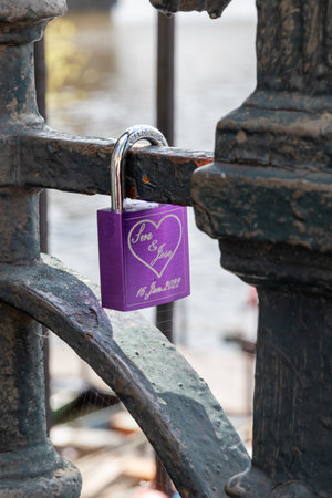 April 25, 2022 Prague Czech Republic. Colored metal padlocks on a fence. A symbol of lovers.のeditorial素材