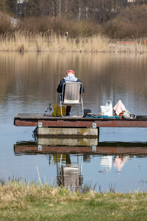 The angler catches fish on the lake. England