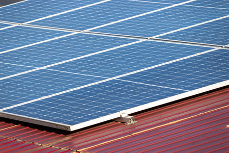 Photovoltaic panels on the roof. View of solar panels in a house on the roof.