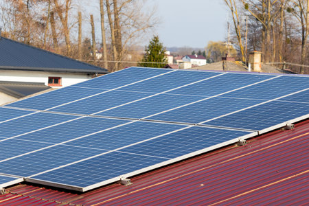 Photovoltaic panels on the roof. View of solar panels in a house on the roof.