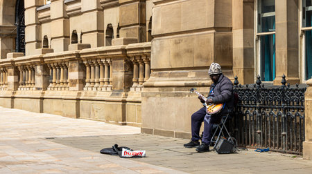 June 12, 2022 Birmingham West Midlands United Kingdom. A man plays the guitar