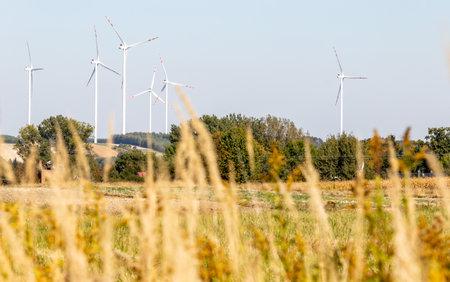 Windmill farm. Landscape in the countryside on a sunny day.