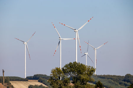 Windmill farm. Landscape in the countryside on a sunny day.