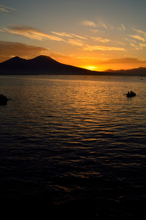 Warm, spring sunrise on the sea with the Vesuvius の写真素材