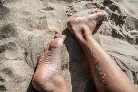 foots on a sandの写真素材