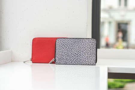 Two cool wallets on the white tableの写真素材