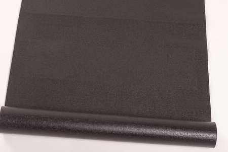 Black Yoga Mat isolated with White Backgroundの写真素材