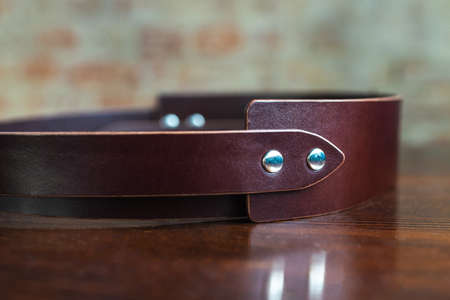 Stylish leather belt on wooden background for mens fashionの写真素材