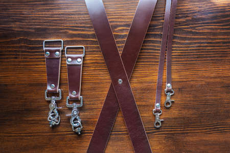 Mens leather trouser belt in the background of aged wood.の写真素材