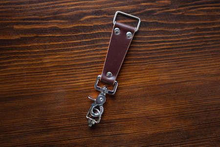 Mens leather trouser belt in the background of aged wood.の写真素材