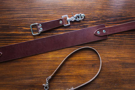 Mens leather trouser belt in the background of aged wood.の写真素材