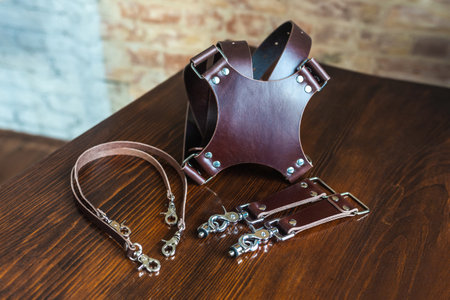 Mens leather trouser belt in the background of aged wood.の写真素材