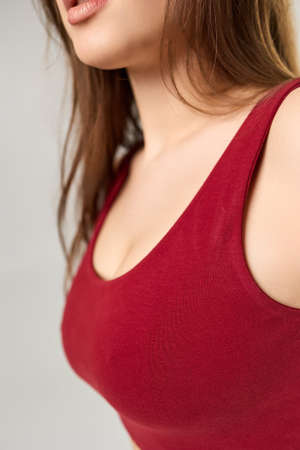 A young girl in a burgundy T-shirtの写真素材