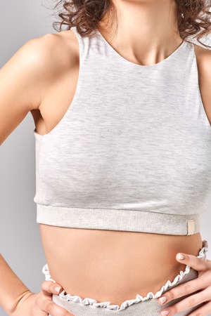 A young girl keeps her hand at her waistの写真素材