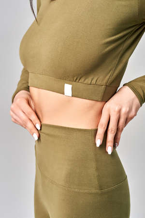 A young girl keeps her hand at her waistの写真素材