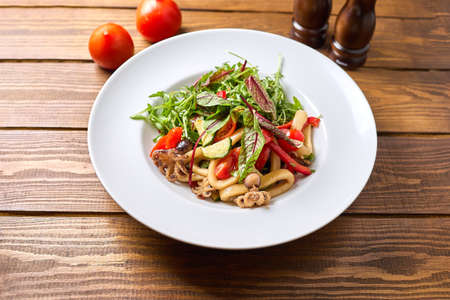 Vegetable salad on a large white plateの写真素材