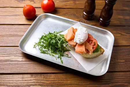 Sandwich with fish and egg on a trayの写真素材
