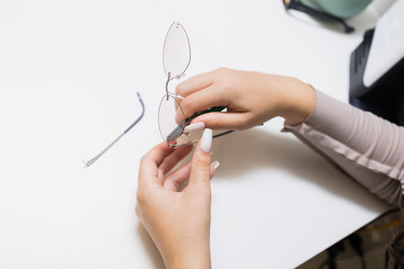 Close-up of Eyeglass Repair with a Small Screwdriver