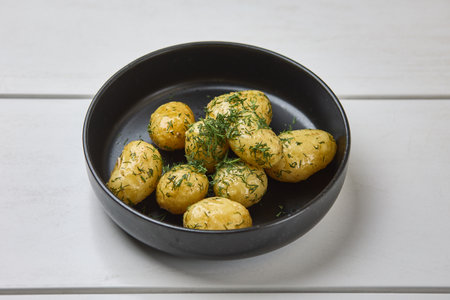 Boiled baby potatoes with fresh dill garnishの写真素材